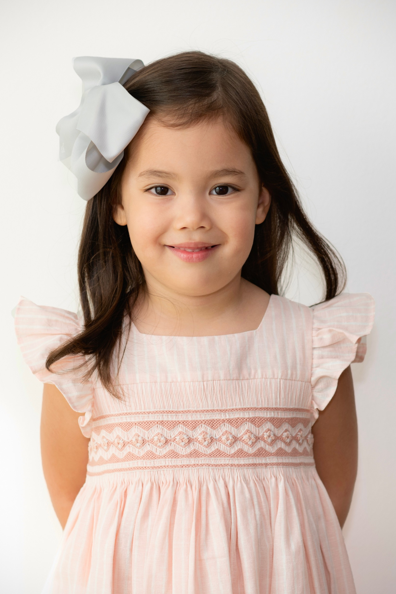 Image Title Charlotte sy Dimby classic timeless traditional smocked dresses for babies and girls handmade French style children clothing paris boutique soft pink striped dress singapour