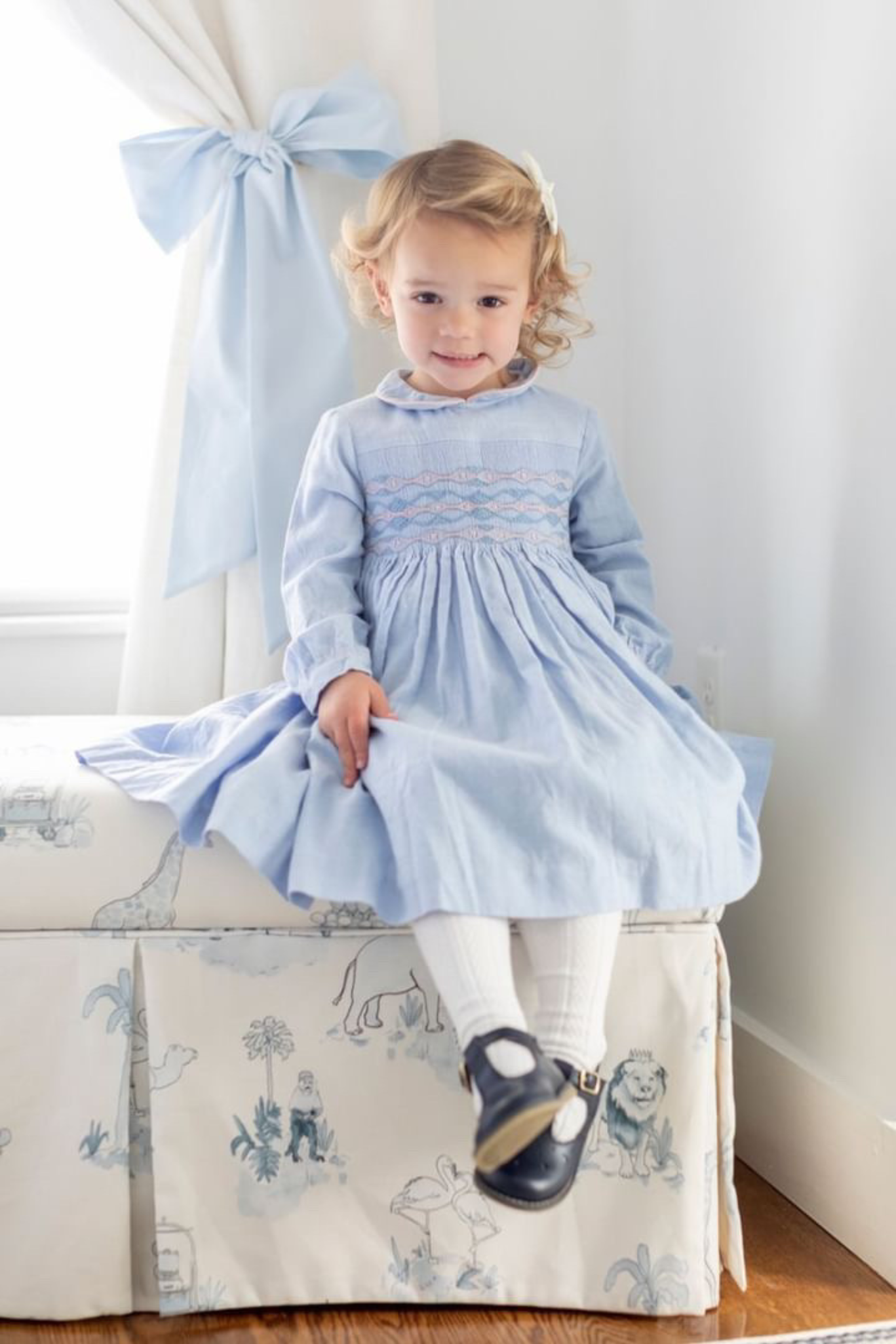 Image Title Charlotte sy Dimby classic timeless traditional smocked dresses for babies and girls handmade French style children clothing paris boutique pastel blue peter pan collar dress heirloom portrait massachusetts