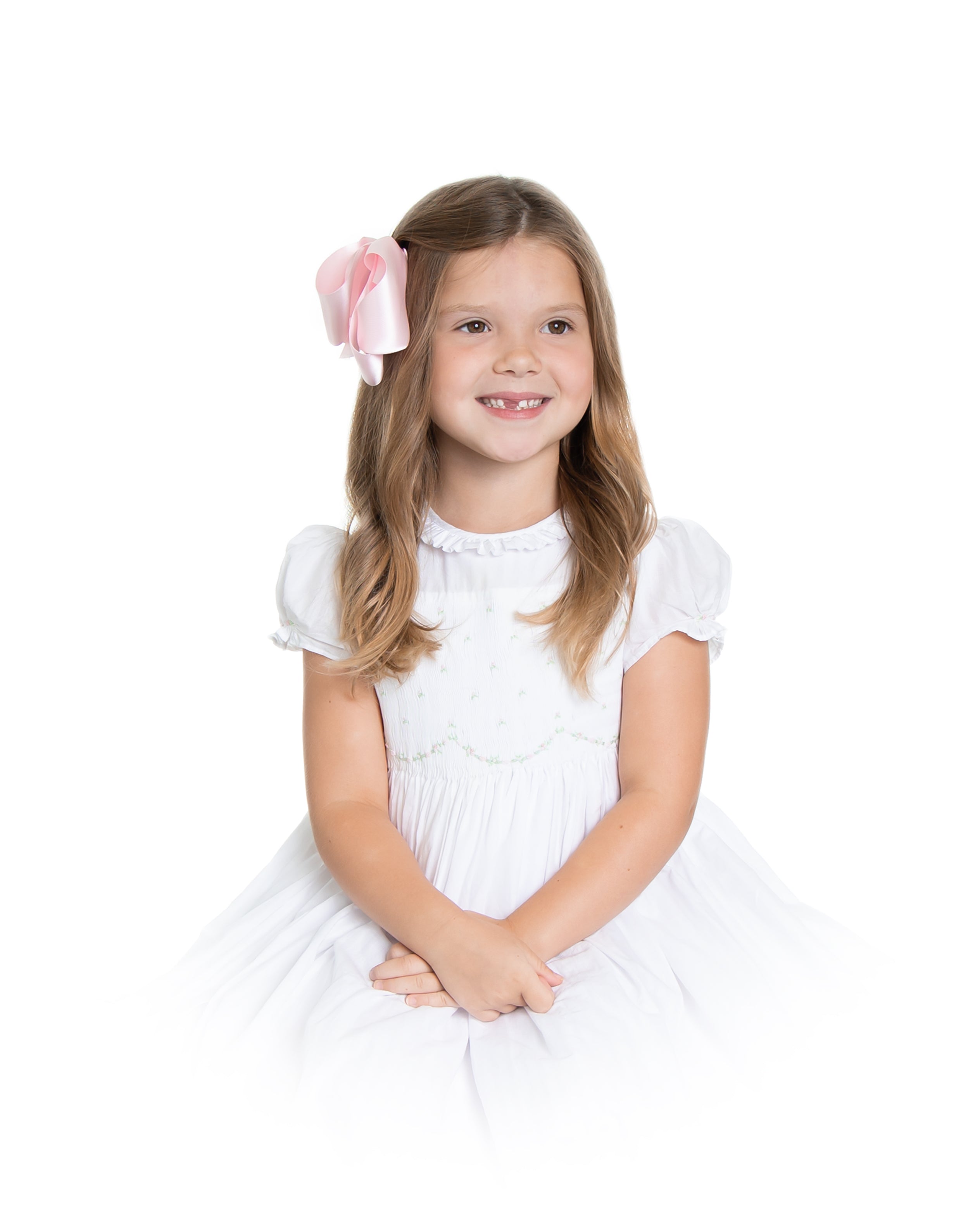 Image Title Charlotte sy Dimby classic timeless traditional smocked dresses for babies and girls handmade French style children clothing paris boutique twirling princess dress white heirloom elegant portrait dress houston texas born and raised studio photography vignette