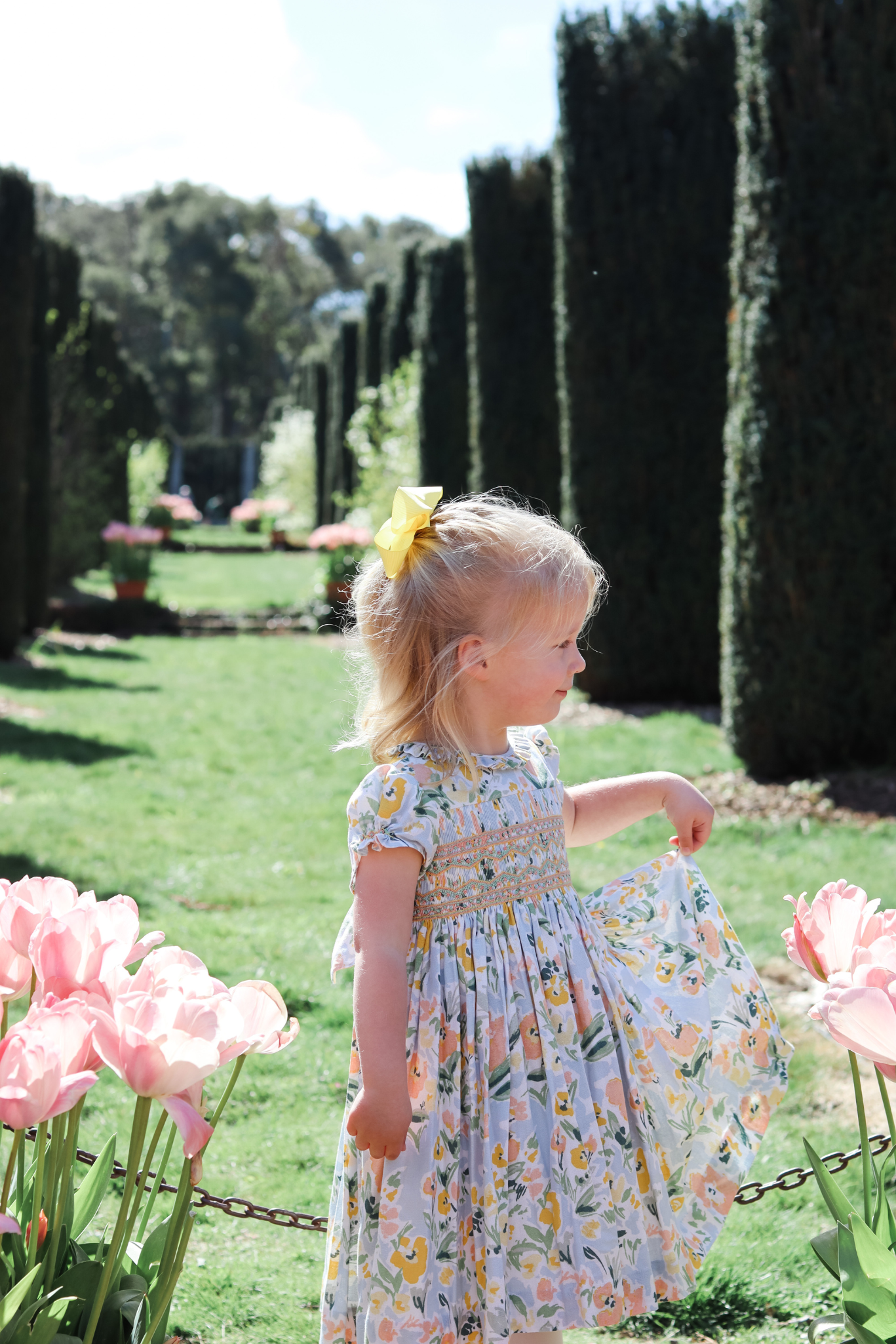 Image Title Charlotte sy Dimby classic timeless traditional smocked dresses for babies and girls handmade French style children clothing paris boutique floral print spring easter dress filoli garden photo shoot california