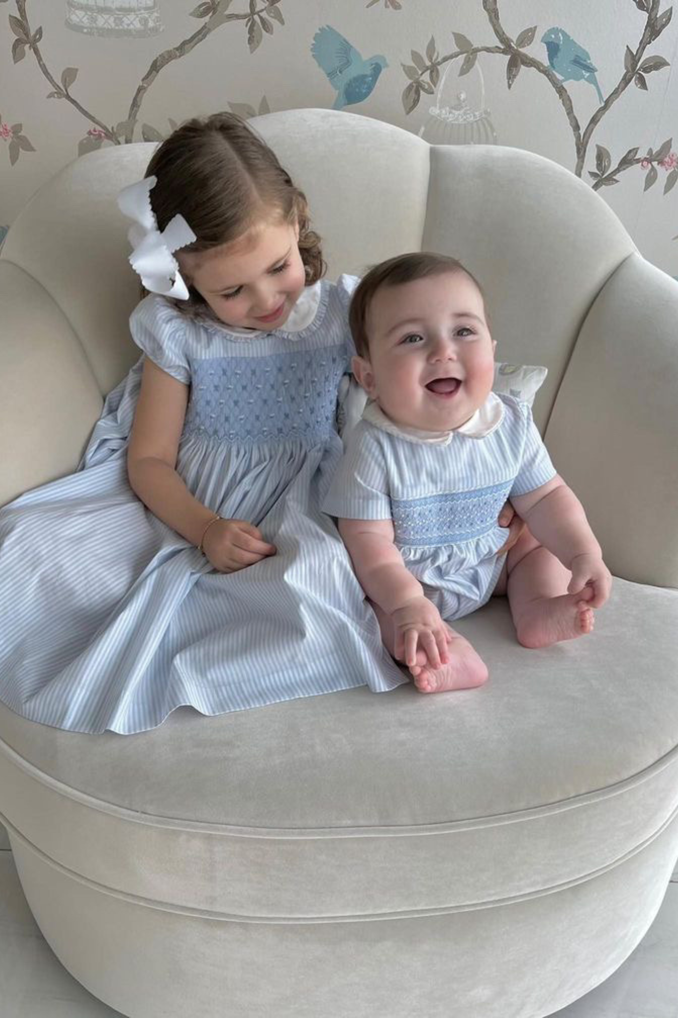 Image Title Charlotte sy Dimby classic timeless traditional smocked dresses for babies and girls handmade French style children clothing paris boutique matching pastel blue striped sibling outfits dress and bubble