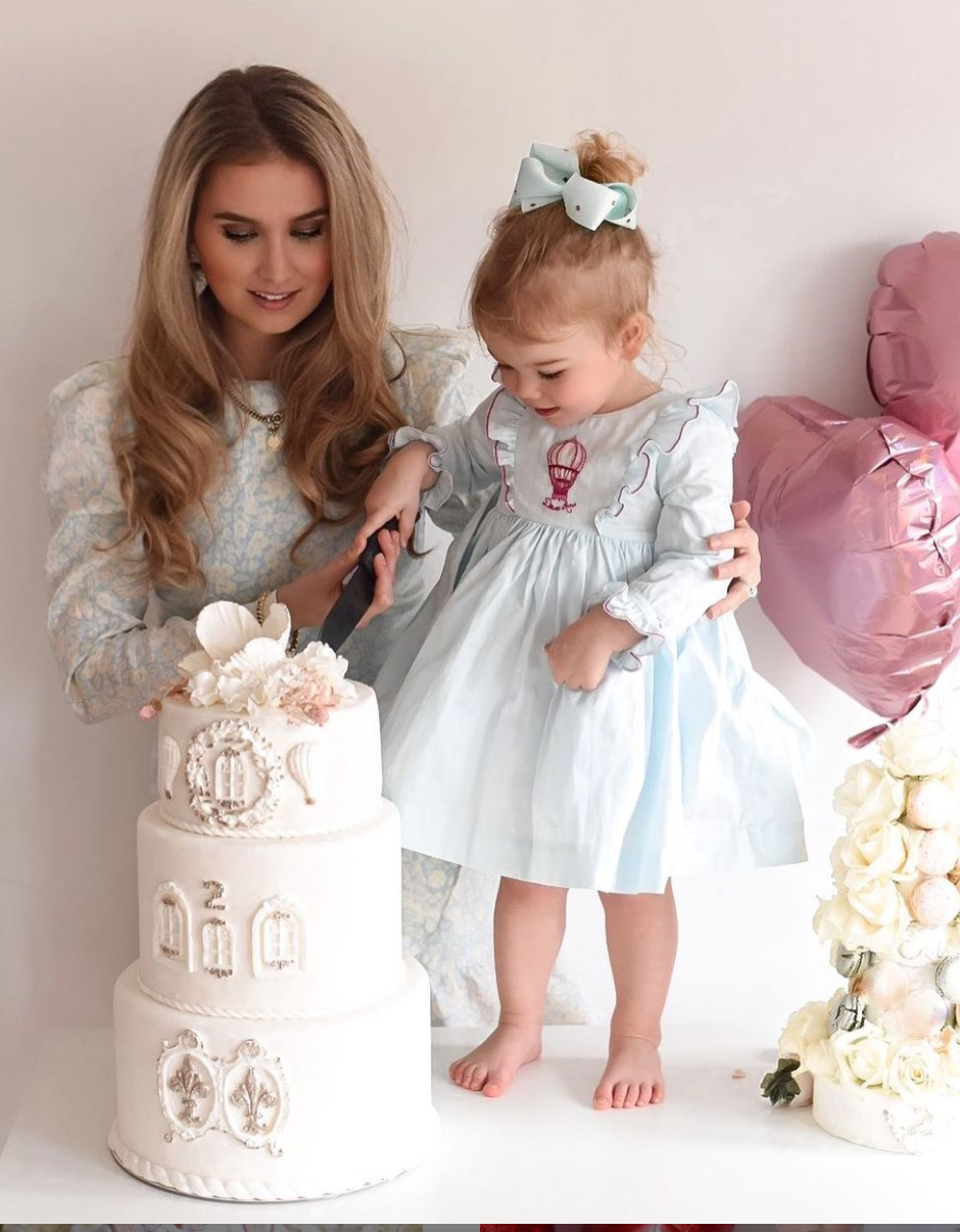 Image Title Charlotte sy Dimby classic timeless traditional smocked dresses for babies and girls handmade French style children clothing paris boutique twirling princess dress birthdat hot air balloon themed dress netherlands embroidery